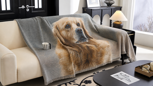 Woven pet photo blanket with a golden retriever portrait draped over a sofa